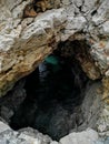 Cave in the rocks makes blue waters