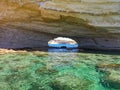 Cave romantic passage with rocky seashore at Malta