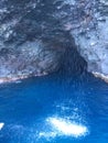 Cave and Waterfall in Napali Coast Mountains and Cliffs Seen from Pacific Ocean - Kauai Island, Hawaii. Royalty Free Stock Photo