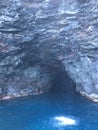 Cave and Waterfall in Napali Coast Mountains and Cliffs Seen from Pacific Ocean - Kauai Island, Hawaii. Royalty Free Stock Photo