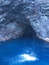 Cave and Waterfall in Napali Coast Mountains and Cliffs Seen from Pacific Ocean - Kauai Island, Hawaii. Royalty Free Stock Photo