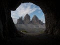 Cave window view of Tre Cime di Lavaredo alpine mountain panorama in Sexten Dolomites Belluno South Tyrol Italy alps Royalty Free Stock Photo