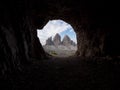 Cave window view of Tre Cime di Lavaredo alpine mountain panorama in Sexten Dolomites Belluno South Tyrol Italy alps Royalty Free Stock Photo