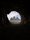 Cave window view of Tre Cime di Lavaredo alpine mountain panorama in Sexten Dolomites Belluno South Tyrol Italy alps Royalty Free Stock Photo