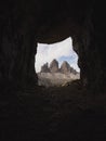 Cave window view of Tre Cime di Lavaredo alpine mountain panorama in Sexten Dolomites Belluno South Tyrol Italy alps Royalty Free Stock Photo