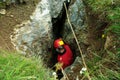 Caver descends in a cave Royalty Free Stock Photo