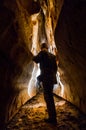 Caver exploring a newly discovered cave passage Royalty Free Stock Photo