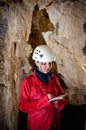 Caver logging survey data during cave mapping Royalty Free Stock Photo