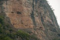 Caves on cliff at Dawu gorge on Daning River, Wuchan, China Royalty Free Stock Photo