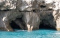 Caves in the cliffs on the island of Capri in the Bay of Naples, Italy. Photographed whilst on a boat trip around the island. Royalty Free Stock Photo