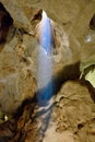 Sunlight beaming into Belfry Cave of the Capricorn Caves system