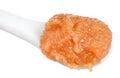 Caviar of alaska pollock in ceramic spoon close up