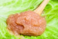 Caviar of alaska pollock in wooden spoon on leaf