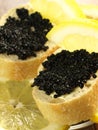 Caviar on baguette, close up Royalty Free Stock Photo