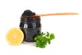 Caviar black in a glass jar with lemon and parsley