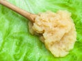 Caviar of capelin in wood spoon on green lettuce