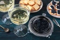 Caviar and champagne, vintage style, with bread and toasts Royalty Free Stock Photo