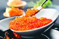 Caviar. Salmon caviar in a bowl. Closeup trout caviar. Gourmet food