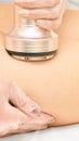 Cavitation machine therapy. Woman body lipo treatment. Ultrasound salon device. Radio frequency cosmetology procedure Royalty Free Stock Photo