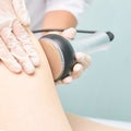 Cavitation rf body treatment. Female ultra sound lipo machine. Spa contouring. Doctor hands Royalty Free Stock Photo