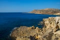 Cavo Greco cape on Cyprus. Travelling and vacation concept. Spectacular rocks on the Mediterranean Sea shoreline. Clean and blue Royalty Free Stock Photo