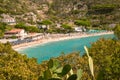 Cavoli, Elba Island, Province of Livorno Italy - September 17 2021 View over sandy colorful beach of little village Cavoli at end