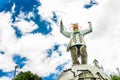 CAYAMBE, ECUADOR - SEPTEMBER 05, 2017: Metallic man monument over a metallic planet, located in the city of Cayambe