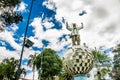 CAYAMBE, ECUADOR - SEPTEMBER 05, 2017: Metallic man monument over a metallic planet, located in a park in the city of