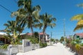 CAYE CAULKER, BELIZE - NOVEMBER 18, 2017: Caye Caulker Island in Caribbean Sea. Sandy Street with Local Architecture and People.