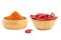 Cayenne pepper with red chilies, paprika powder in a wooden bowl, and spicy condiments Isolated on a white background - clipping Royalty Free Stock Photo