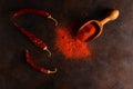 cayenne pepper on wooden spoon spices and dried chilli peppers background Royalty Free Stock Photo