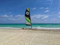 Cayo Coco, Cuba, May 16, 2021: sailing boat stands on a sandy beach against the backdrop of the azure ocean and the blue sky Royalty Free Stock Photo