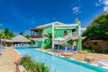 gorgeous amazing view of Colonial hotel grounds, beautiful inviting swimming pool and retro stylish buildings on blue sky