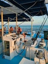 Cayo Guillermo, Cuba, 16 may 2021: Steering wheel of the boat and the captain`s seat with people resting. Vertical