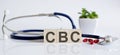 CBC the word is written on the wooden cubes and sthetoscope and piils . Medical concept