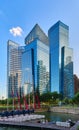 CBD or Central Business District buildings over Marina Bay waters and catamaran boat jetty in day light, Singapore.