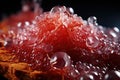 CBG Gummies. a pile of red crystals on top of a table Royalty Free Stock Photo