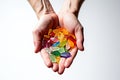 CBG Gummies. a pair of hands holding a bunch of candy Royalty Free Stock Photo