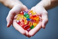 CBG Gummies. a pair of hands holding handfuls of candy Royalty Free Stock Photo