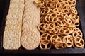 Cclose-up of wooden box with cookies, crackers and mini salted pretzels Royalty Free Stock Photo