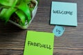 CConcept of Welcome vs Farewell write on sticky notes isolated on Wooden Table Royalty Free Stock Photo