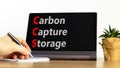 CCS Carbon capture storage symbol. Concept words CCS Carbon capture storage on beautiful black tablet. Beautiful white background