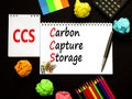 CCS Carbon capture storage symbol. Concept words CCS Carbon capture storage on beautiful black note. Beautiful yellow background.