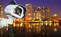 CCTV with Blurring City in night background. Royalty Free Stock Photo