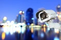 CCTV with bokeh blurring city in night background. Royalty Free Stock Photo