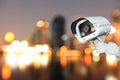 CCTV with bokeh blurring city in night background. Royalty Free Stock Photo
