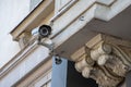 CCTV camera attached on the wall of the building, monitoring and tracking, monitoring the situation Royalty Free Stock Photo