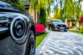 A CCTV camera capturing footage of a driveway, with a car pulling in and the system automatically recognizing the vehicle and