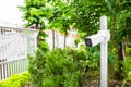 CCTV camera is installed in the garden with blur green tree background for monitor and safety system control around that area Royalty Free Stock Photo