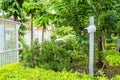 CCTV camera is installed in the garden with blur green tree background for monitor and safety system control around that area Royalty Free Stock Photo